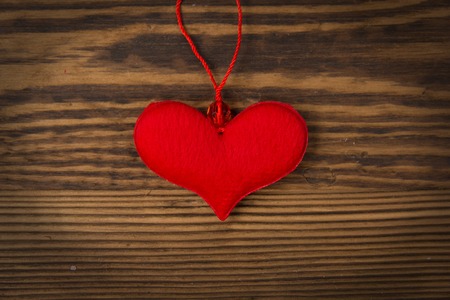 Red heart on wooden backgroundの写真素材