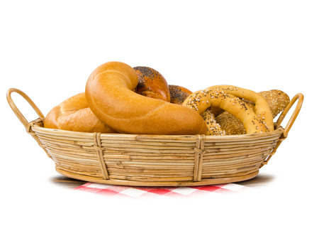 Rolls and buns in a basket isolated on whiteの写真素材