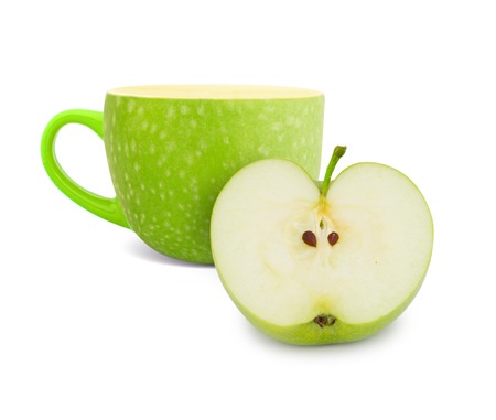 Photo of cup with green apple slice - tea conceptの写真素材