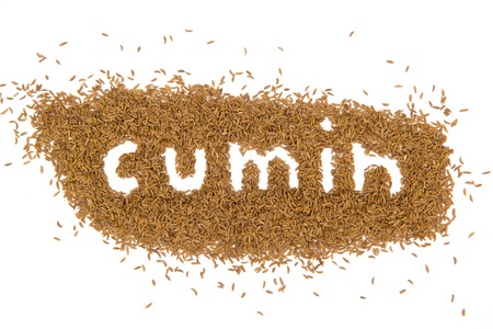 Photo of cumin with text isolated on whiteの写真素材