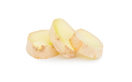 Photo of ginger root with slices isolated on whiteの写真素材