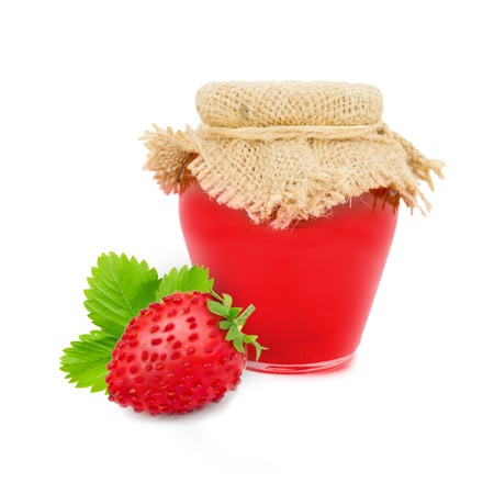 Photo of glass with strawberry jam isolated on whiteの写真素材