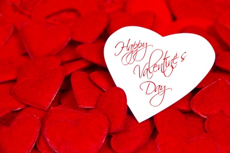 Background with white paper heart and red heartsの写真素材