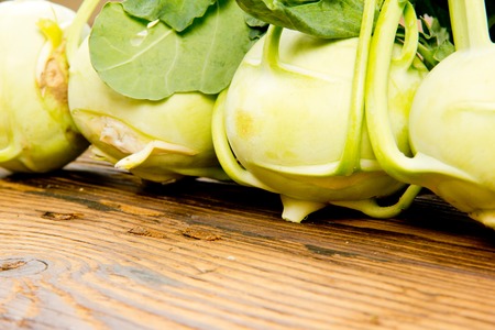 Photo of kohlrabi heads on wooden boardの写真素材