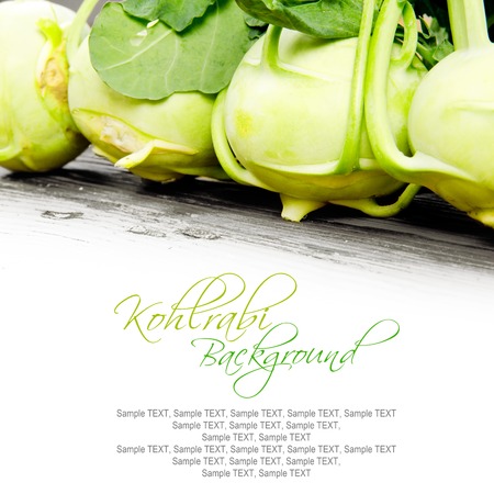Photo of kohlrabi heads on wooden board with white spaceの写真素材