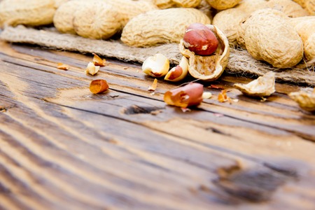 Photo of peanuts on wooden boardの写真素材