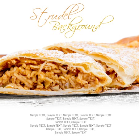 Photo of sliced apple strudel on wooden board with white space for textの写真素材