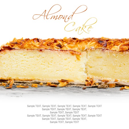 Photo of sliced almond cake on wooden board with white space for textの写真素材
