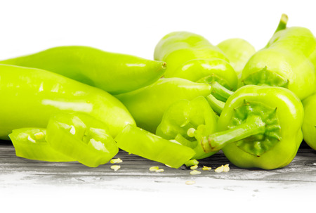 Photo of peppers on wooden board with white spaceの写真素材