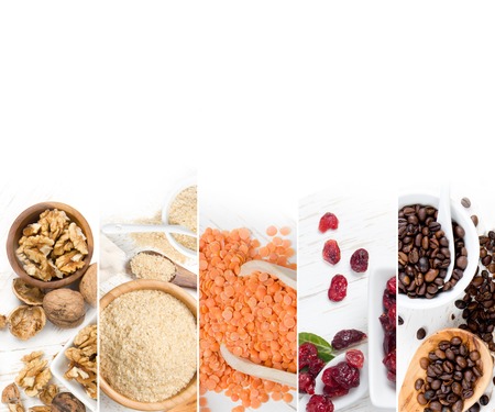 Top view of mixed colorful berries, nuts and seeds scattered on white wooden surface; dieting and detoxication conceptの写真素材
