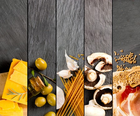 Top view of ham, pasta, cheese and vegetable on gray slate surface; healthy eating conceptの写真素材