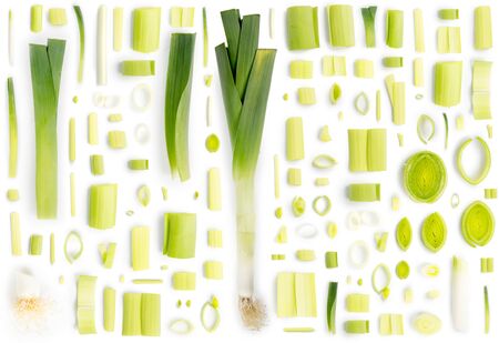 Large group of green leek pieces isolated on white background. Seamless abstract pattern.の写真素材