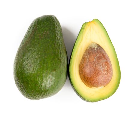 Green avocado with slice isolated on white background.