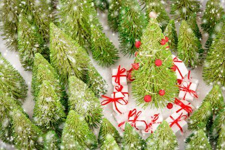 Christmas Tree with Gifts in the forest covered with snow. Christmas concept.の写真素材