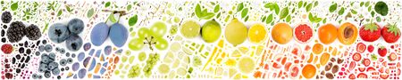Large collection of colorful fruit pieces, slices and leaves isolated on white