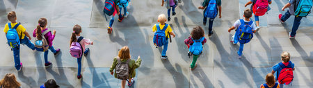 Aerial view of group of children going to school. Back to school concept.の素材