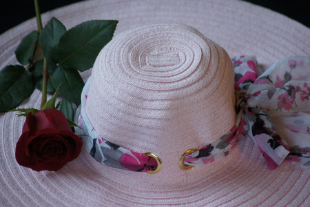 Woman s pretty pink garden hat with red rose の写真素材