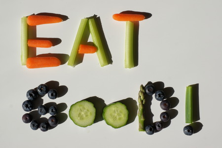 The words EAT GOOD! made up from fruit and vegetables.の写真素材