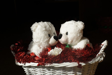 White stuffed valentine bears in basket.の写真素材