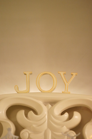 Christmas decoration in the form of the word JOY, soft glow in background.の写真素材