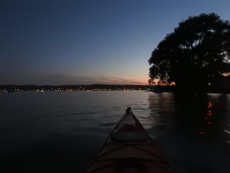 Kayak on the lake in the evening at sunset. Beautiful landscape.の写真素材