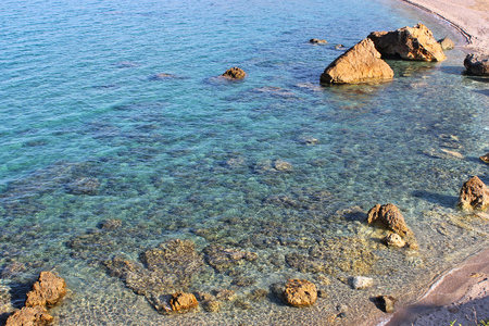 A greek rocky beach with clear water at south Pelionの写真素材