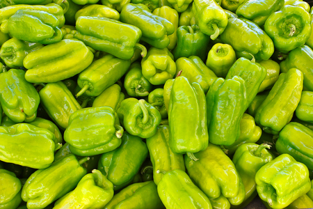 Full frame of fresh green peppers at the marketの写真素材