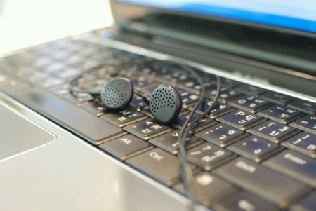 Earphone put on laptop computerの素材