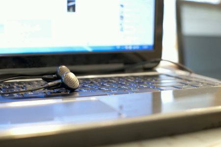 Earphone put on laptop computerの素材
