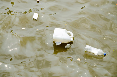 Water pollution. Trash and Garbage in waterの写真素材
