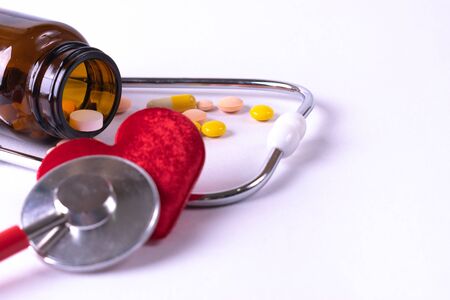 The heap color mix tablets pills drug with wooden background. World health day. Pharmacy industry.の写真素材