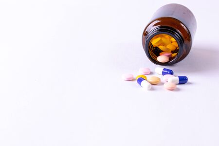 World health day, Healthcare and medical concept. The heap color mix tablets pills drug with white...