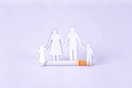 May 31st World No Tobacco Day. Cigarette and family figure. Stop Smoking Concept. Save family from...