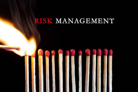 Photo of burning matchstick. Risk management concept.