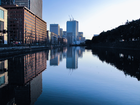 Building reflections on a riverの写真素材