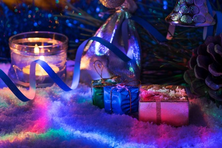 Beautiful New Year decor with candles and garlandの写真素材