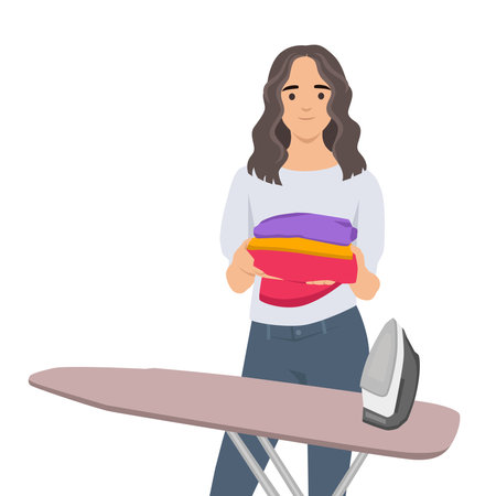 Woman beside an ironing board holding neatly folded colorful clothes with an iron nearby. Flat vector illustration isolated on white backgroundのイラスト素材