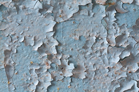 exfoliated  old blue paint on the wallの写真素材
