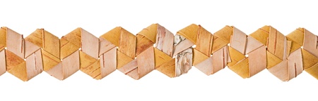 Braided pattern of birch bark, isolated on white.の写真素材