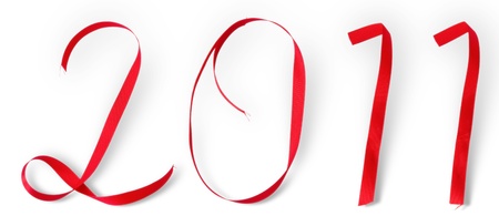 number 2011 from a red ribbon with a shadow, isolated on whiteの写真素材