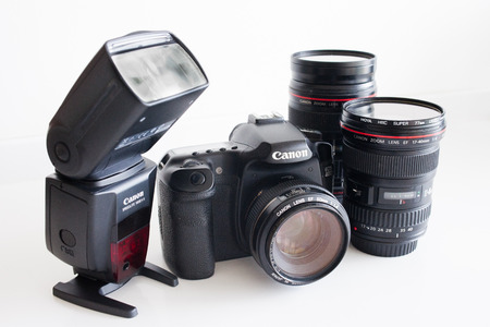 dslr canon camera with lenses and external flashのeditorial素材