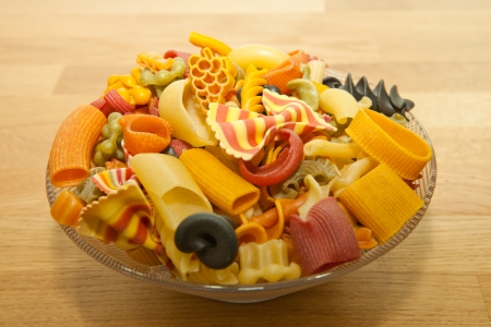 colorful pasta mix on a wooden deckの写真素材