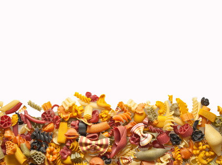 colorful pasta mix isolated on whiteの写真素材