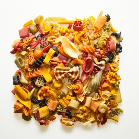 colorful pasta mix isolated on whiteの写真素材