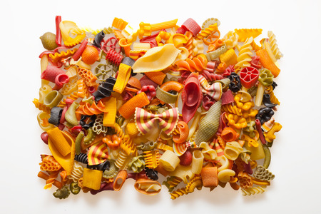 colorful pasta mix isolated on whiteの写真素材