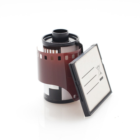 Analog Camera film roll and Digital dslr Camera memory card side by sideの写真素材