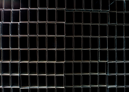 Grid of square metal pipesの写真素材