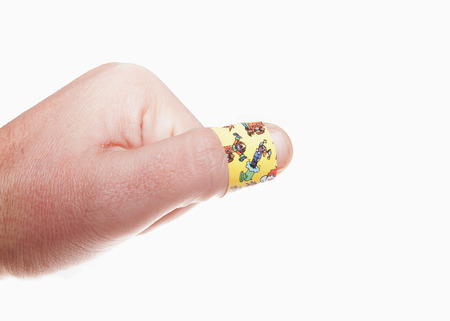 Hand with Colourful plaster isolated on white