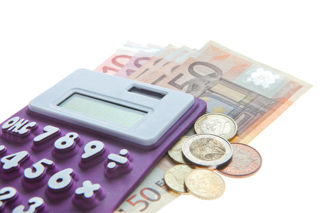 Arrangement of Calculator, Euro notes and Euro coins isolated on whiteの写真素材