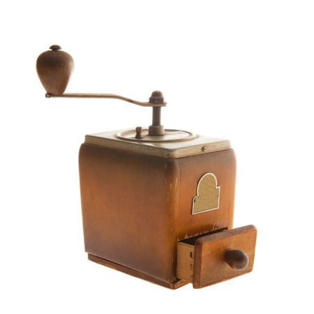 Old coffee grinder isolated on whiteの写真素材